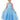 Young girl wearing a blue dress with star pattern on a white background