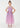 Young girl wearing a pink dress with star patterns on a white background