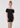 A Teen Girl wearing a black off-shoulder dress on a white background
