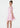 Young girl wearing a pink dress on a white background