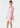 Young girl wearing a pink dress on a white background