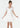 Woman wearing a white dress with puffed sleeves on a white background